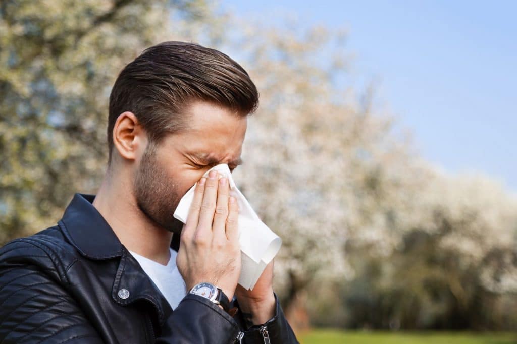 man sneezing