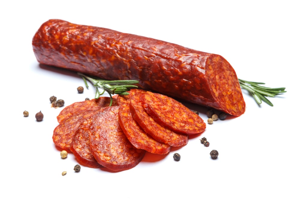 A closeup of chorizo and parsley.