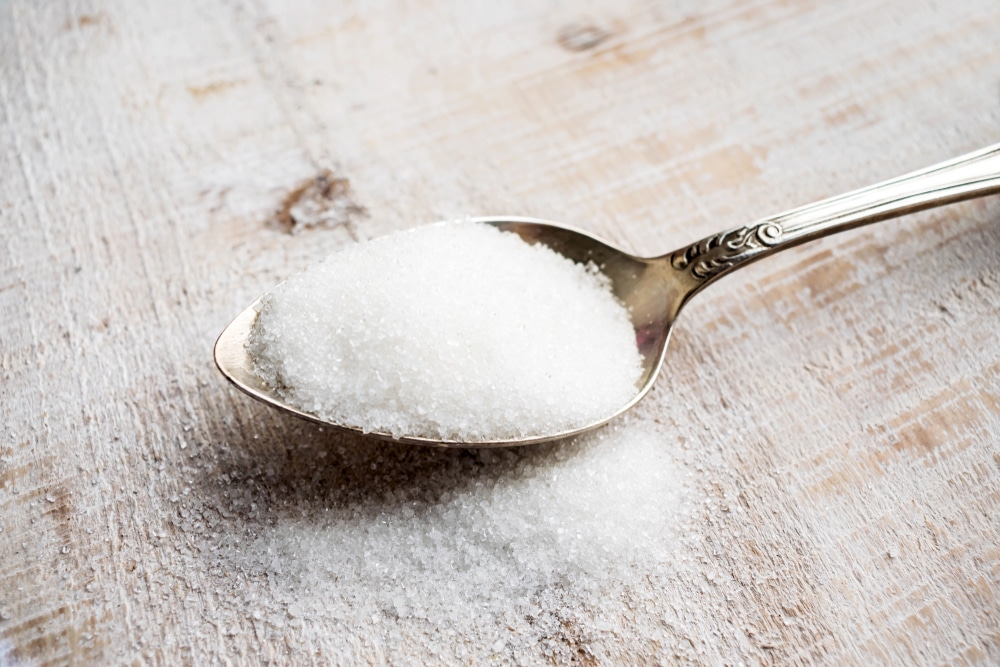 A closeup of a spoonful of aspartame.
