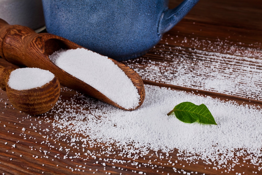 Some sorbitol in wooden containers and spilled out on floorboards.