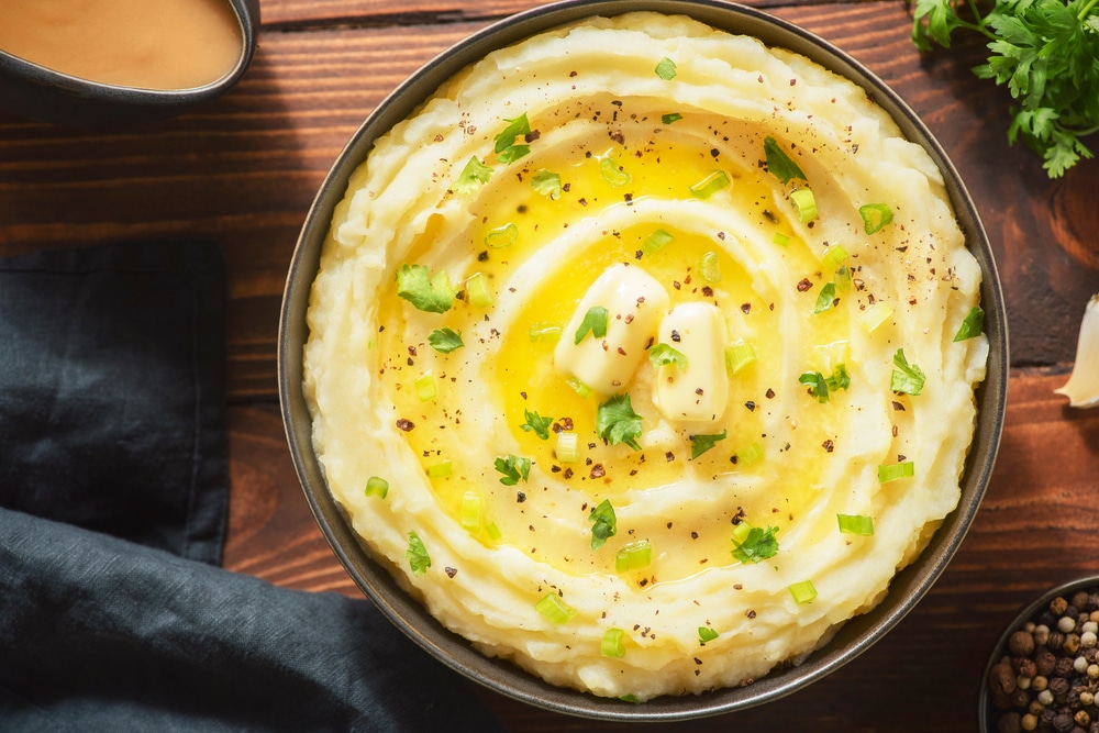 An overhead closeup of a bowl of mashed potatoes.