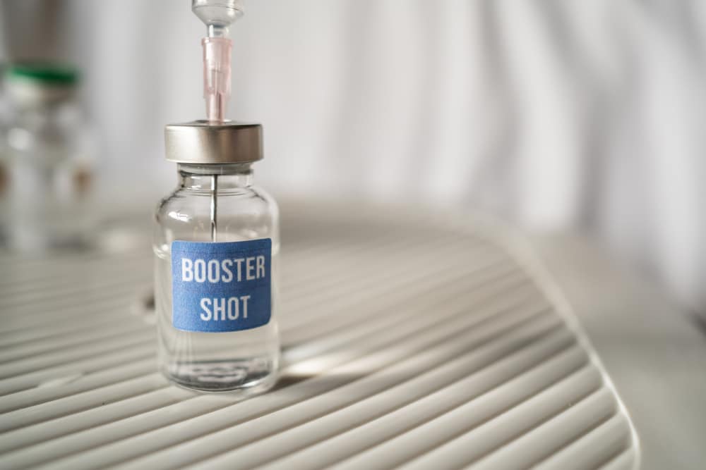 A needle in a booster shot bottle.