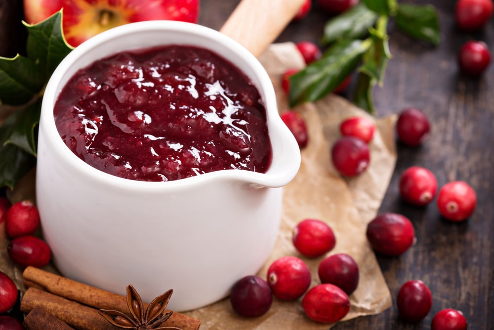 A cup of cranberry sauce.